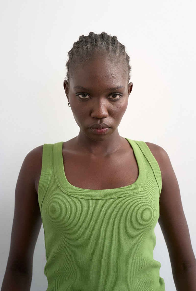 Front image of a model wearing Honey vest in green, by brand Top shop