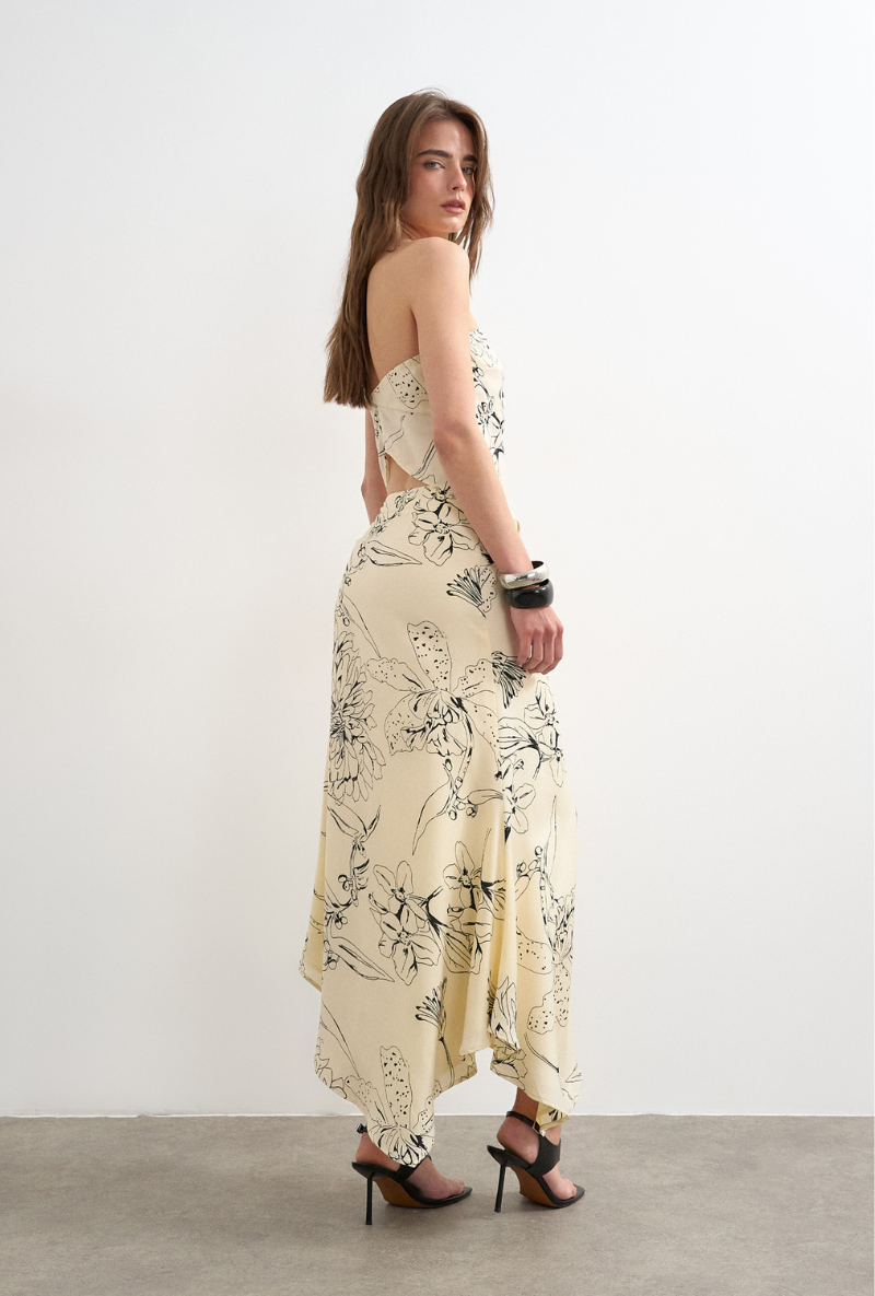 Back image of a model wearing Mani asymmetric slip skirt in cream, by brand Top shop