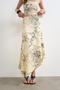 Front image of a model wearing the Mani asymmetric slip skirt in cream, by brand Top shop