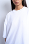 Front image of a model wearing the Ida oversize dropshoulder tee in white, by brand Top shop