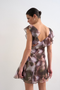 Back image of a model wearing the Rikke ruffle mini dress in brown, by brand Top shop