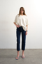 Front image of a model wearing Runway cropped jeans in dark denim, by brand Top shop