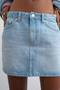 Front detail image of a model wearing the Silje mini denim skirt in denim, by brand Top shop