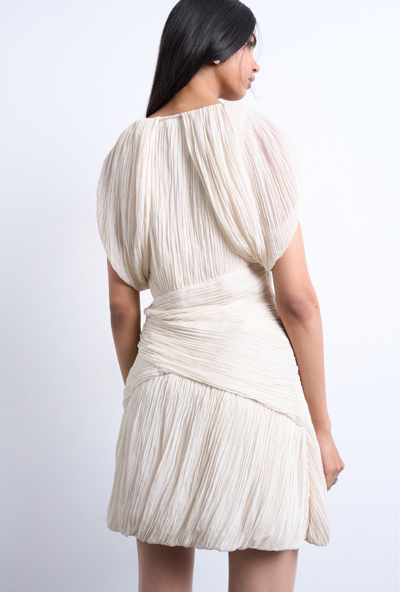 Back image of a model wearing Svea drape mini dress in beige, by brand Top shop