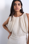 Front image of a model wearing the Svea drape mini dress in beige, by brand Top shop