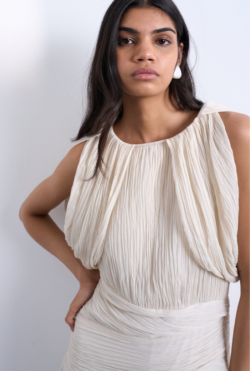 Front image of a model wearing Svea drape mini dress in beige, by brand Top shop