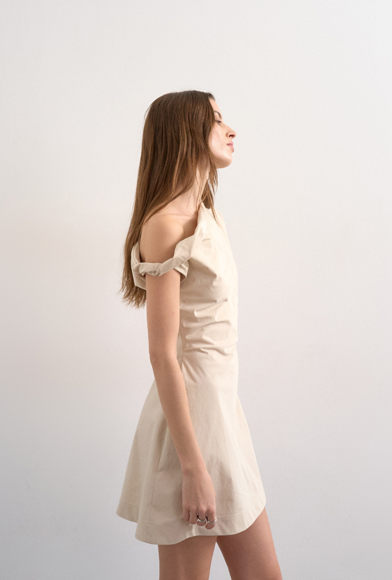 Front image of a model wearing Zenia mini dress in ecru, by brand Top shop