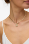 Front image of a model wearing Chelly necklace in gold, by brand Vero moda