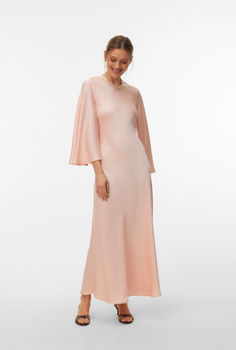 Front image of a model wearing Vero moda eleanor ls wide sleeve dress in peach, by brand Vero moda