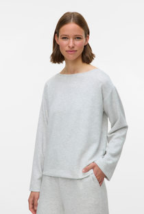 Front image of a model wearing the Vero moda hali l/s boat neck top in light grey, by brand Vero moda