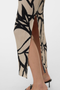 Front detail image of a model wearing the Malene ankle skirt in black/white, by brand Vero moda