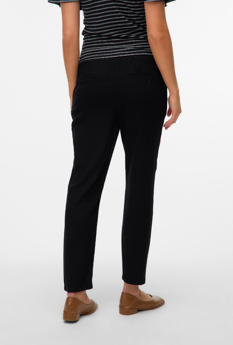 Back image of a model wearing Milo ankle pants in black, by brand Vero moda