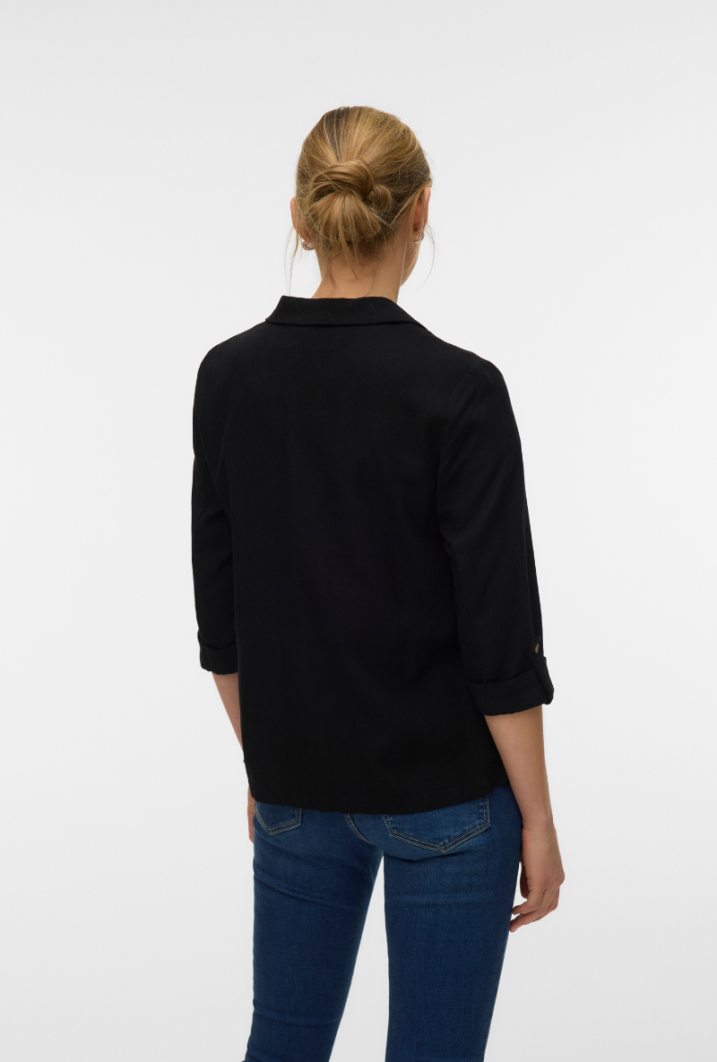 Back image of a model wearing Milo loose blazer in black, by brand Vero moda
