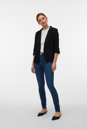 Front image of a model wearing Milo loose blazer in black, by brand Vero moda