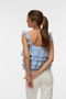 Back image of a model wearing the Sandy layered top in blue, by brand Vero moda