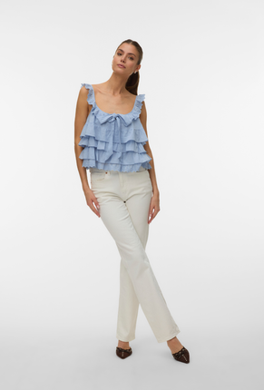 Front image of a model wearing Sandy layered top in blue, by brand Vero moda