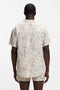 Back image of a model wearing the Beach shirt in beige, by brand Boss