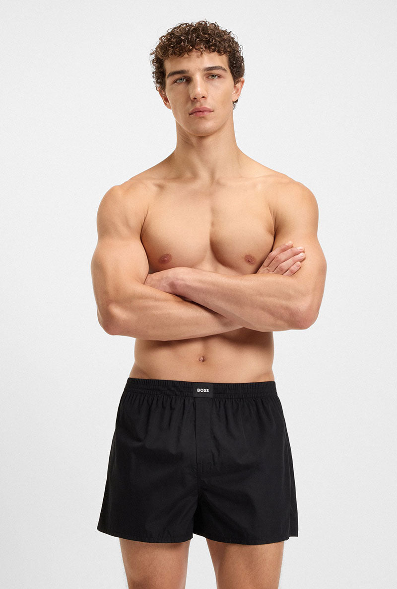 Front image of a model wearing Cw peach 2 pk boxer shorts in black, by brand Boss