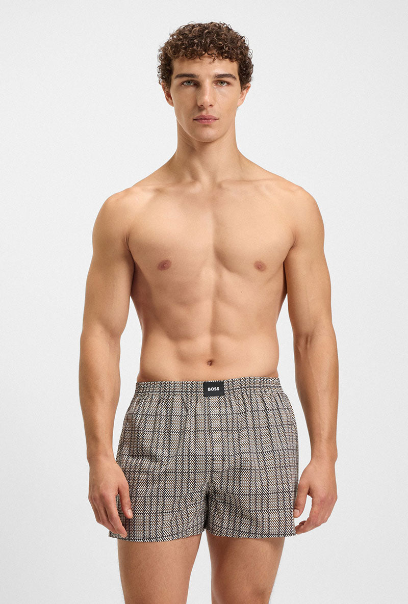 Front image of a model wearing Cw peach 2 pk boxer shorts in black, by brand Boss