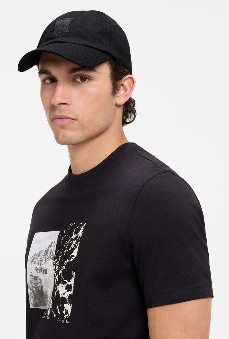 Front image of a model wearing Derrel cap in black, by brand Boss