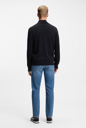 Back image of a model wearing the Kanozip knitwear in navy, by brand Boss