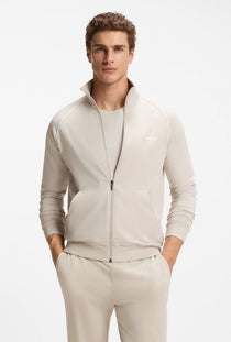 Front image of a model wearing the Mix and match jacket in beige, by brand Boss