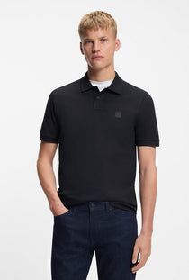Front image of a model wearing the Passenger polo in navy, by brand Boss