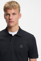 Front image of a model wearing the Passenger polo in navy, by brand Boss