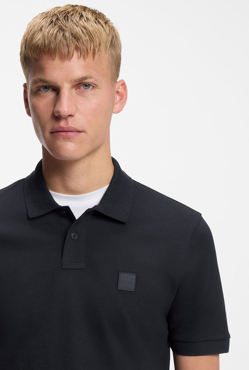 Front image of a model wearing Passenger polo in navy, by brand Boss