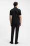 Back image of a model wearing the Philix zip polo in black, by brand Boss