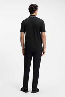 Back image of a model wearing the Philix zip polo in black, by brand Boss