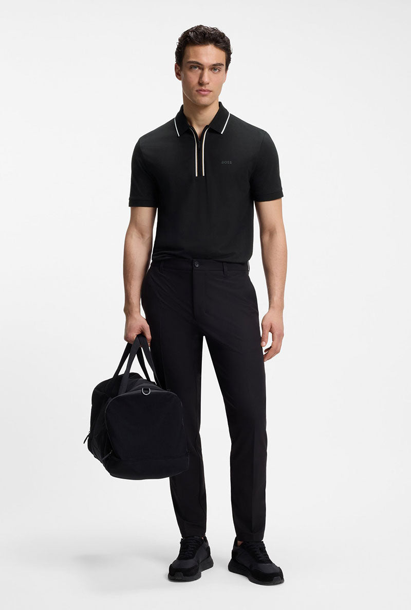 Front image of a model wearing Philix zip polo in black, by brand Boss