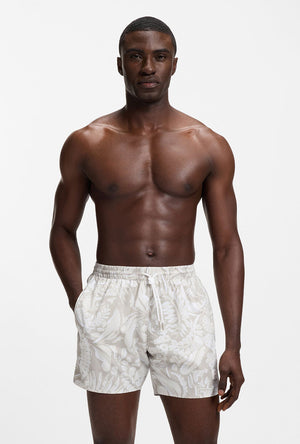 Front image of a model wearing the Piranha swimshorts in beige, by brand Boss
