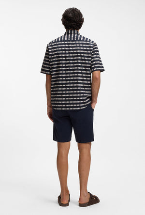 Back image of a model wearing the Rash 2 aop ss shirt in navy, by brand Boss