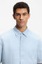 Front image of a model wearing the Rash 2 ss shirt in light blue, by brand Boss