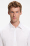 Front image of a model wearing the Relegant ls shirt in white, by brand Boss