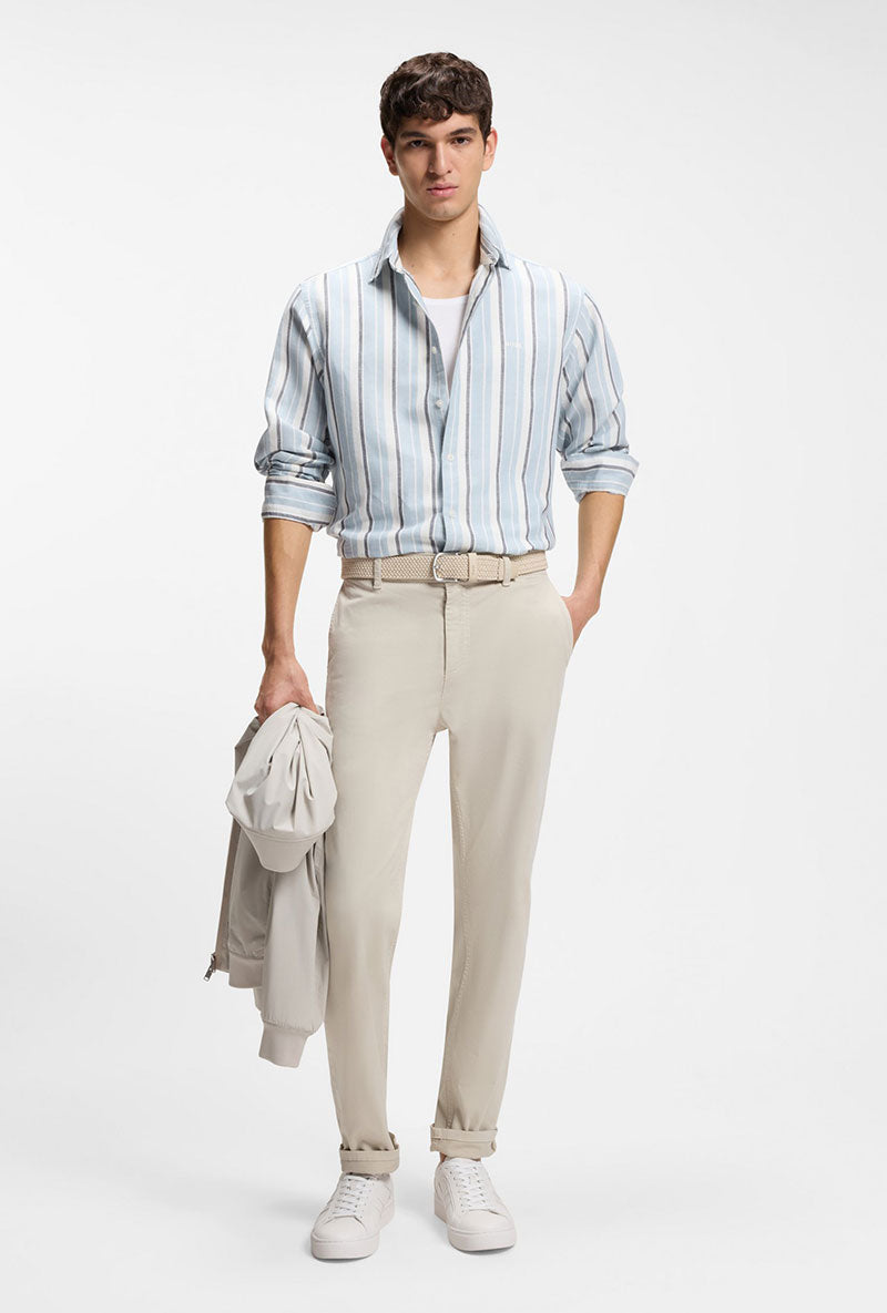 Front image of a model wearing Rhys trainers in white, by brand Boss