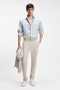 Front image of a model wearing the Rhys trainers in white, by brand Boss