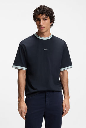 Front image of a model wearing Te blocks tshirt in navy, by brand Boss