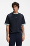 Front image of a model wearing Te blocks tshirt in navy, by brand Boss