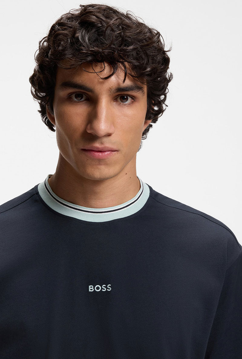 Front image of a model wearing Te blocks tshirt in navy, by brand Boss