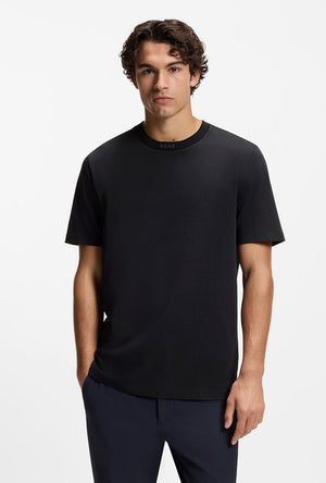 Front image of a model wearing the Tee 5 t-shirt in navy, by brand Boss