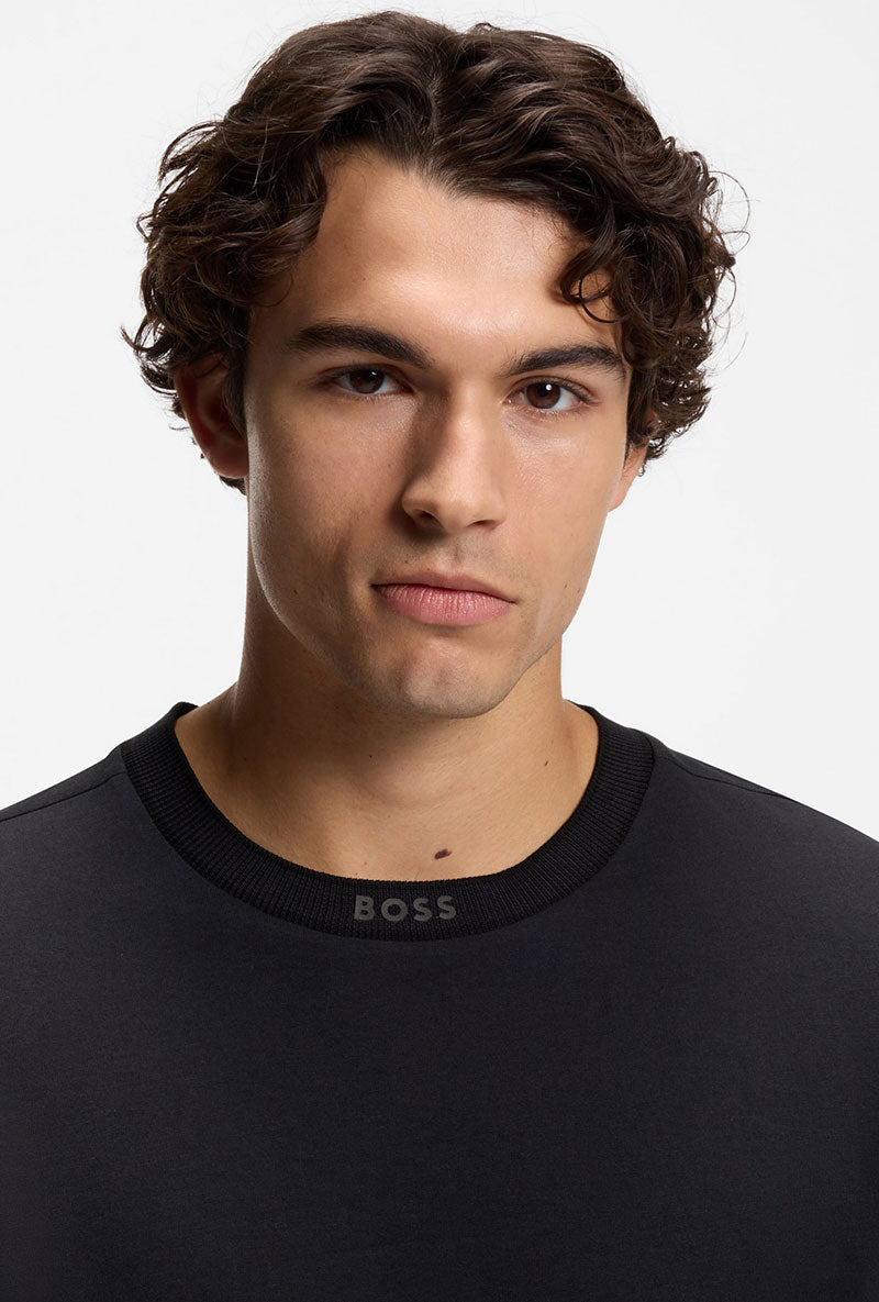 Front image of a model wearing Tee 5 t-shirt in navy, by brand Boss