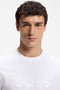 Front image of a model wearing the Tegood t-shirt in white, by brand Boss