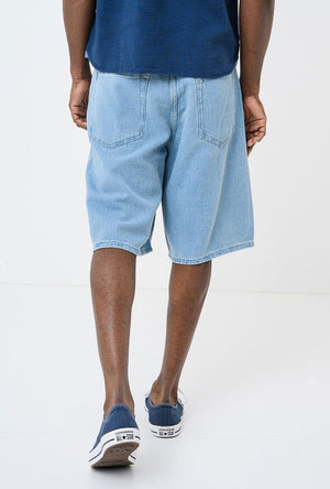 Back image of a model wearing the Mason bermuda shorts in denim, by brand Hugo