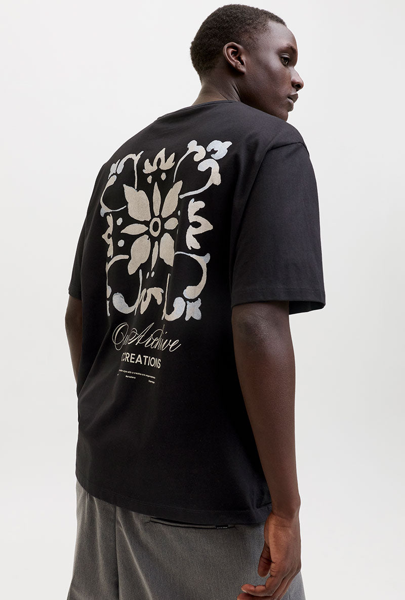 Back image of a model wearing Art print tee in black, by brand Jack&jones