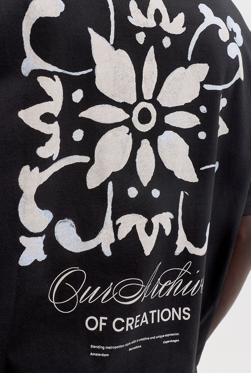 Back image of a model wearing Art print tee in black, by brand Jack&jones