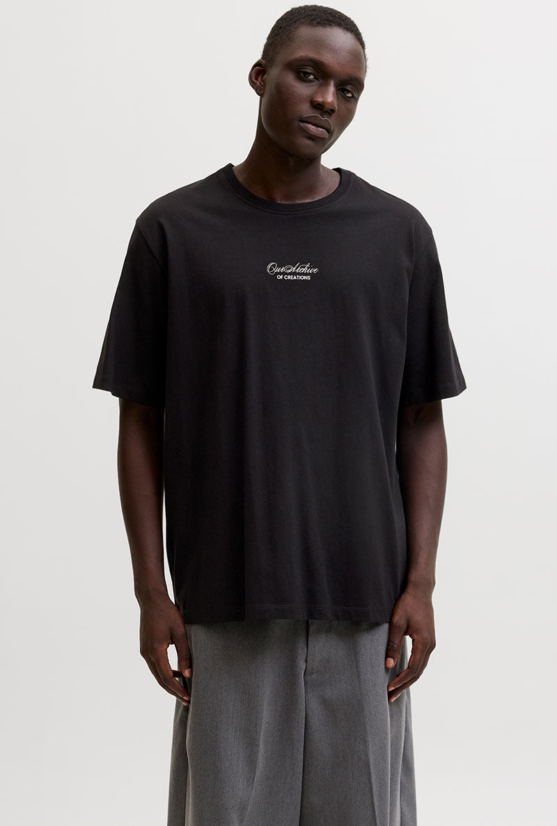 Front image of a model wearing Art print tee in black, by brand Jack&jones
