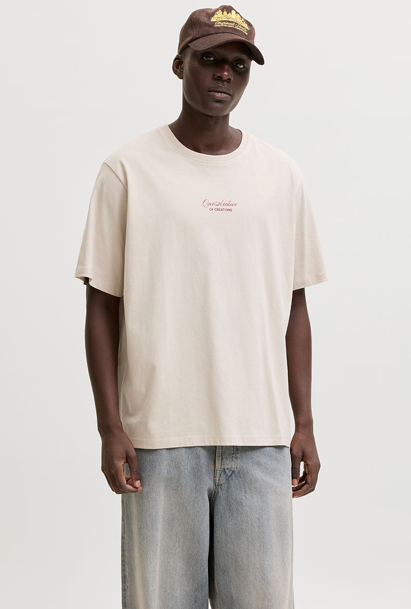Front image of a model wearing Art print tee in beige, by brand Jack&jones