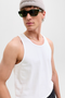 Front image of a model wearing the Jack and jones basic tanktop in white, by brand Jack&jones